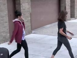 Madonna covered completely by a long scarf is led from Kaballah by son David in New York 10/08/2011 (Footage by WireImage Video/Getty Images Entertainment Video) Stock Footage