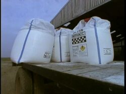 MCU fertilizer sacks on trailer, Agriculture Stock Footage