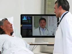 MS PAN Doctors Video Conferencing with Patient in Hospital / Richmond, Virgnia, United States Stock Footage