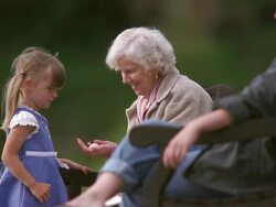MS PAN Girl giving shell to her grandmother and hugging her in park / Washington State, USA Stock Footage
