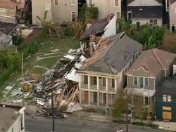 Sept. 12, 2005 aerial collapsed building in wake of Hurricane Katrina / zoom out skyline / New Orleans Stock Footage