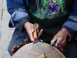 Miao ethnic traditional weaving crafts,upwards pan,MS Stock Footage