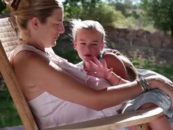 MS Shot of young girl resting on her pregnant mothers lapy / Phoenix, Arizona, United States Stock Footage