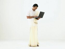 Portrait of a south Indian man working on laptop Stock Footage