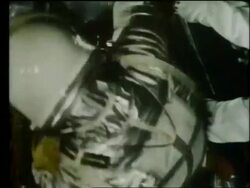 close up of John Glenn getting into Mercury capsule Stock Footage