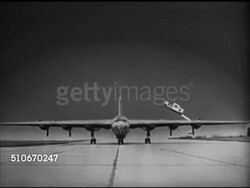 1953: ANIMATION: Convair B-36 'Peacemaker' bomber illustration on tarmac, highlighting wing span w/arch, 230 feet, comparing line of 120 feet flight distance of Orville Wright. Instructional Video