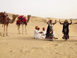 Three rajasthani women dancing on desert, Sam Desert, Jaisalmer, Rajasthan, India Stock Footage