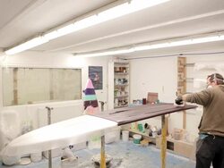 MS Resin being applied to surfboard / Wadebridge, Cornwall, United Kingdom Stock Footage