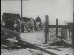 Cars loaded with furniture leave a farm in Oklahoma. News Clip