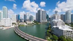View from Brickell Key, a small island covered in apartment towers, towards the Miami skyline, Miami, Florida, USA - Time lapse Stock Footage
