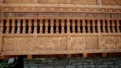 Steady cam shot of ornately carved wooden Hindu Temple panels. Stock Footage