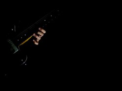 Picking guitar in darkness Stock Footage