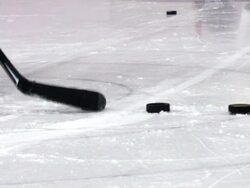 HD:M.S.Shot of Hockey Player Shooting at Goal Stock Footage