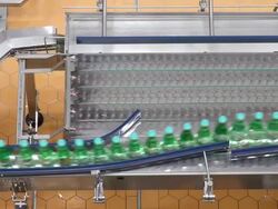 MS Shot of bottle moving in bottling plant at beverage industry / Gerolstein, Rhineland Palatinate, Germany  Stock Footage