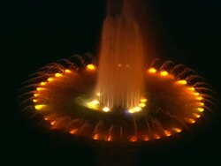 Aerial ECU fountain at night, with orange and yellow lights in water, Century City / Beverly Hills, California, United States. Stock Footage