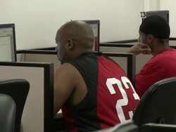 2009 MS Two men using computers in job center computer lab/ Antioch, California, USA/ AUDIO Stock Footage