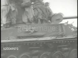 1951: KOREAN WAR: VS African American United States Marines artillery regiment firing cannons, soldiers riding moving tank, soldier firing M2 Browning machine gun, M4 Sherman tanks firing, soldiers moving over hills. 38th Parallel, Korea Instructional Video