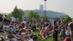 Grateful Dead 50th Anniversary Fare Thee Well concert Woman Holding sign reading, 'Jerry is watching,' July 4, 2015 Stock Footage