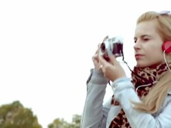 Young woman taking photos with retro camera Stock Footage