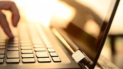 HD:Young woman typing on laptop keyboard Stock Footage