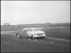 Montage: Rambler and Corvair turning corner Stock Footage