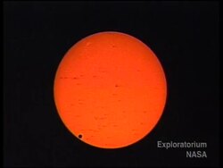 Planet slides across face of the sun News Clip