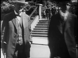 B/W 1917 Henry Ford + Josephus Daniels removing hats standing outside posing for camera Stock Footage