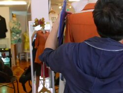 Fashion Designer adjusting clothes on a mannequin Stock Footage