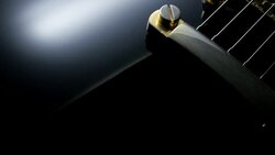 Electric Guitar On Black Background. Tracking Shot Stock Footage