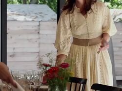 MS TU two sisters in discussion smiling setting table for dinner on front porch of home Stock Footage