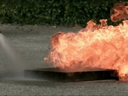 High speed water fire extinguisher, putting out fire Stock Footage