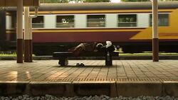 Homeless Sleep on Bench Stock Footage