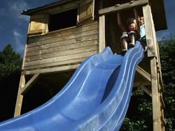 Kids sliding (Shot on Red) Stock Footage