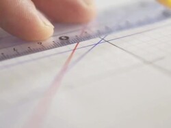 Drawing a line on checkered paper Stock Footage