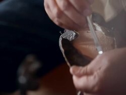 CU PAN TU TD boot maker gluing vamp to sole of cowboy boot Stock Footage