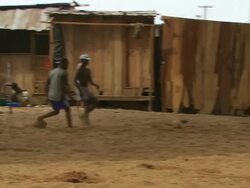 WS TS View of football players under bridge with passing on players / Lagos, Nigeria Stock Footage