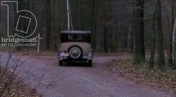Car driving through the countryside, 1930s - reenactment, clip 10 Stock Footage