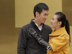 MS Portrait of young couple smiling standing by yellow wall/ China Stock Footage