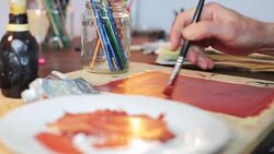 Artist applying base color close up. Stock Footage