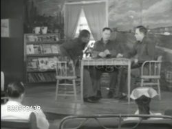 1951: TEACHING HOSPITAL: DRAMA THERAPY: Psychiatrist in room w/ stage set BG. Patients walking onto set, 'role playing' identities at table given by doctor (no SOT), doctor watching, patients arguing. SOT Patients w/ doctor reviewing 'performances' Instructional Video