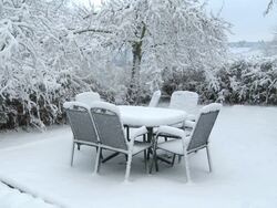 WS Snow covering on garden furniture / Saarburg, Rhineland-Palatinate, Germany Stock Footage