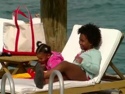 MS,  family of four taking photographs of themselves on wooden pier,  Harbour Island,  Bahamas Stock Footage