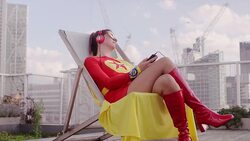 Superhero listening to headphones on city rooftop Stock Footage