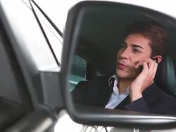 HD:Businessman driving talking on mobile phone Stock Footage