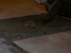 Tiler tiling the floor Stock Footage