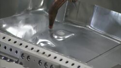 Robots weld small parts in an automotive factory. Stock Footage