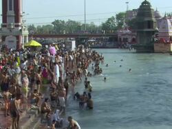 WS PAN People on banks of  Ganges at Hari ki Pauri / Haridwar, Uttarakhand, India Stock Footage