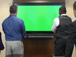 Business Professionals in Front of Chroma Key Monitor Stock Footage