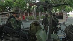 Thailand - Thai PM Yingluck Shinawatra found guilty of abuse of power / Troops on streets of capital / Thailand army chief announces military has seized power to restore stability in country / Army imposes night time curfew following military coup / Anti-coup protesters defy military's ban on large gatherings / Ousted Thai Cabinet minister arrested at news conference after condemning coup News Clip