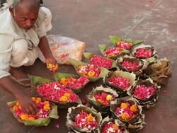 Street vendor selling worship items in the market, Haridwar, Uttarakhand, India Stock Footage